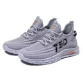Low-top casual sneakers with mesh upper in colours black, grey, and beige on a flat plastic sole