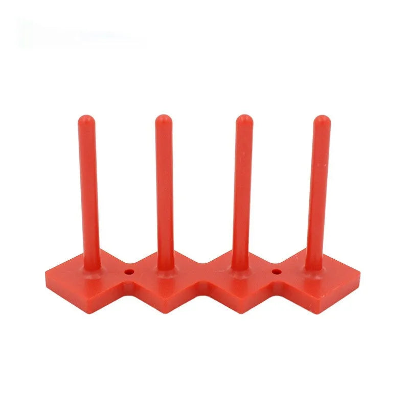 Plastic sewing machine bobbin storage rack with magnetic wire core bracket and four columns in blue, green, orange, red