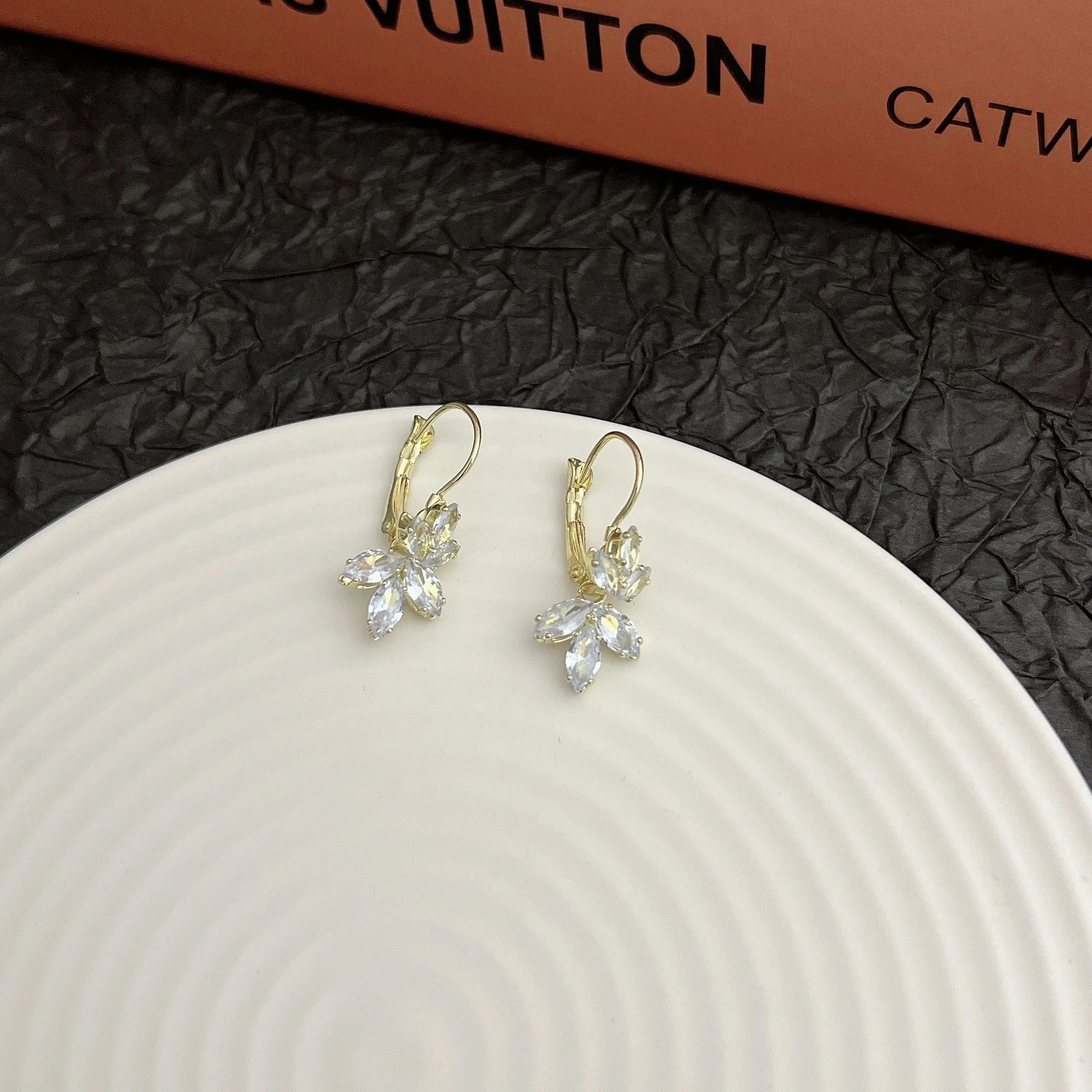 Alloy women's earrings with inlaid zircon leaves design platinum colour