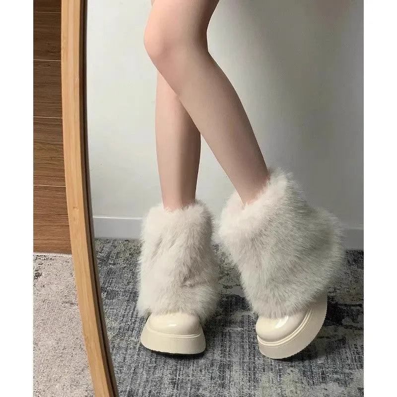 Women's black snow boots with fleece lining, waterproof platform, and rubber sole on a white background