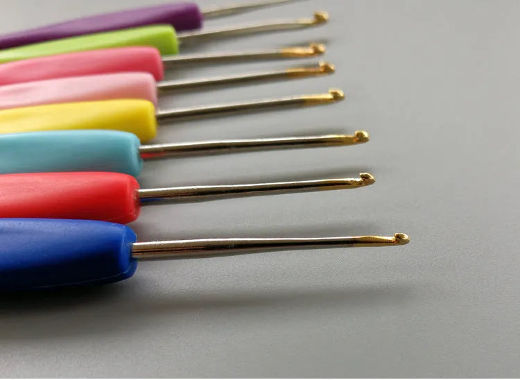 Set of 16 crochet hooks with thick and thin handles inside a black PU storage bag.