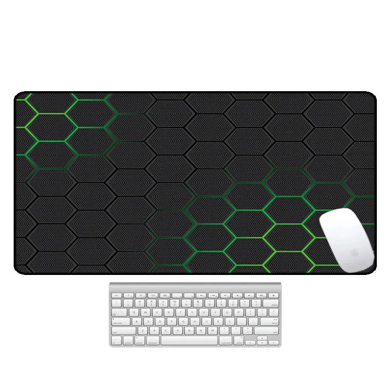 Large desk pad with printed pattern on a wooden desk, showing non-slip rubber base.