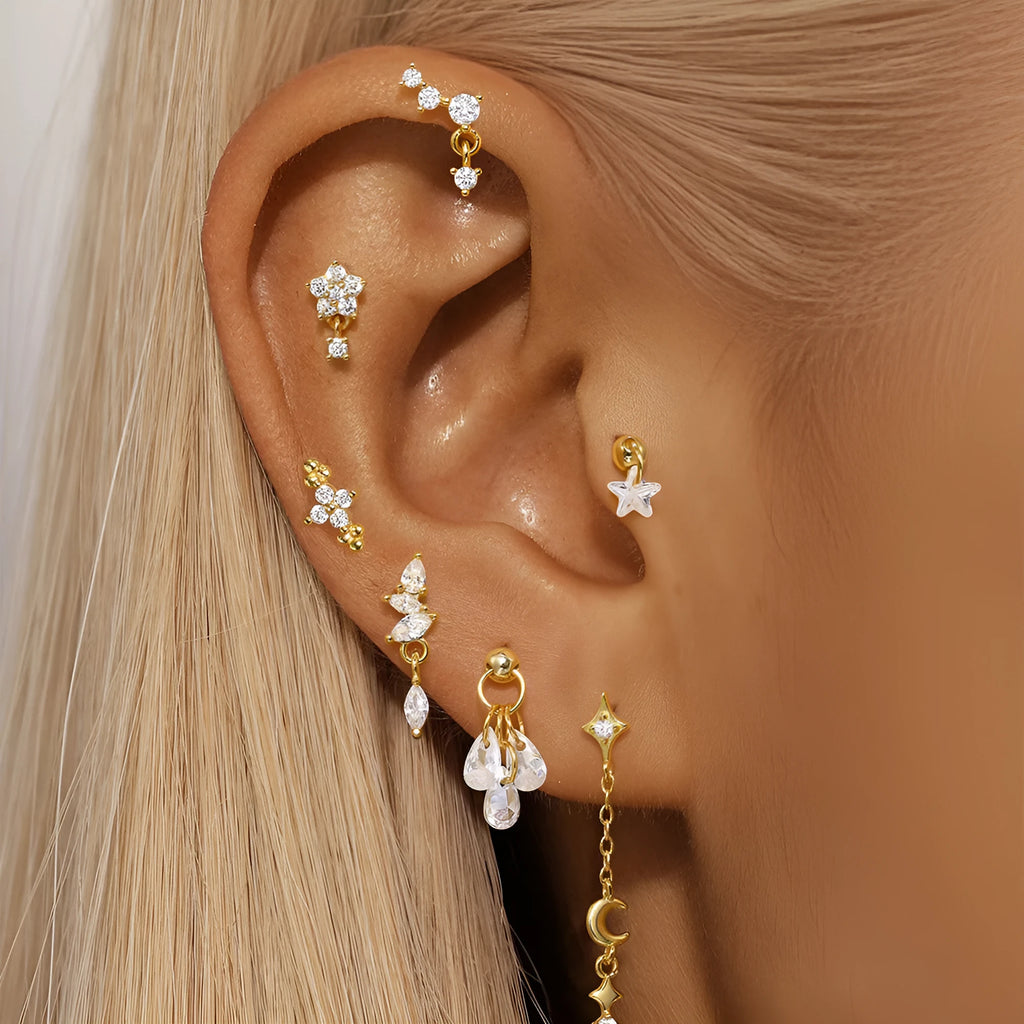 Geometric S925 sterling silver moon and star earrings with diamond embedded embellishment on a white background.