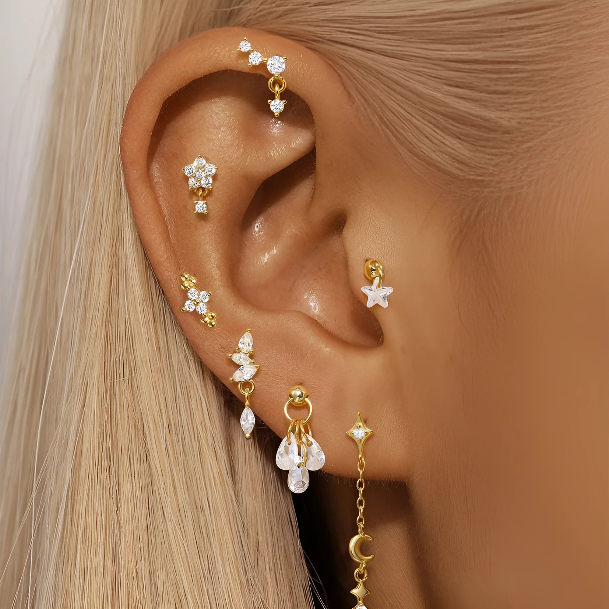 Geometric S925 sterling silver moon and star earrings with diamond embedded embellishment on a white background.