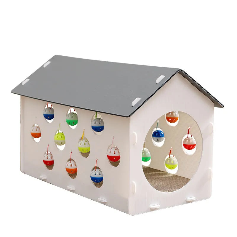 Plastic house-shaped cat scratch board with integrated bell ball toy for feline enrichment