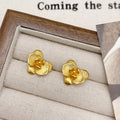 Retro flower-shaped drop earrings for women in gold or silver electroplate with petal detailing.