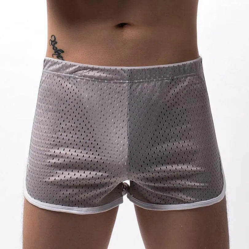 Men's three-point boxers in a cotton and nylon blend, shown in black, on a mid-waist fit model.