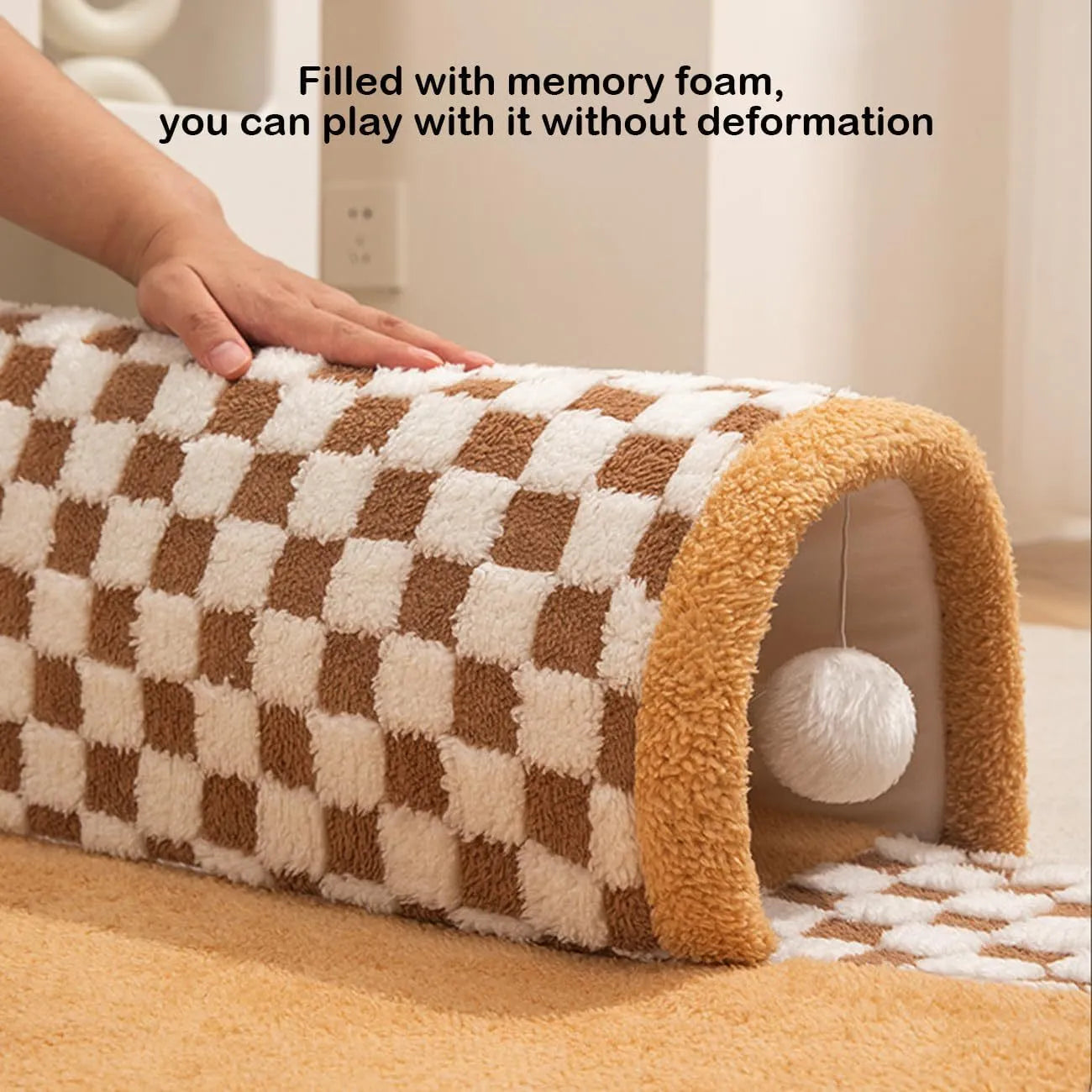 XL sized fan-shaped plush pet bed with an attached tunnel in coffee colour on a wooden floor.