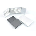Mini tri-fold Bluetooth keyboard shown unfolded and folded, in black and silver colours
