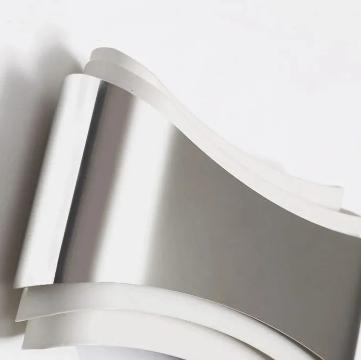 Modern white LED wall lamp with rectangular PMMA shade on a wall.