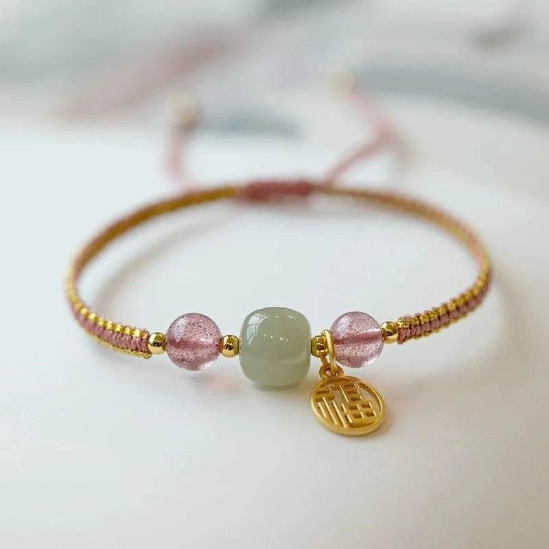 Adjustable red rope bracelet with strawberry quartz beads, showcasing national style design.