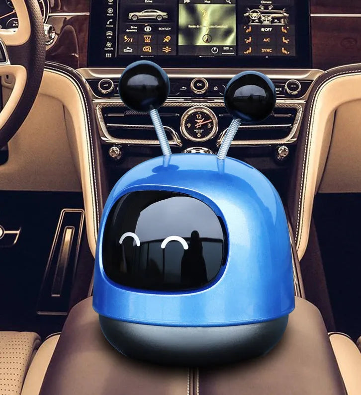 Robot-shaped car vent clip air freshener with aromatherapy gel in blue, grey, or red colour options.