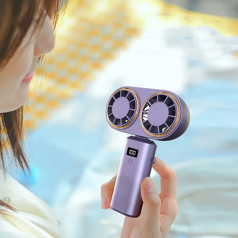 Dark blue handheld mini fan with a digital display screen and a folded neck loop.
