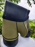 Men's solid colour boxer shorts in thin fabric, shown in army green, highlighting breathable and body-shaping design.