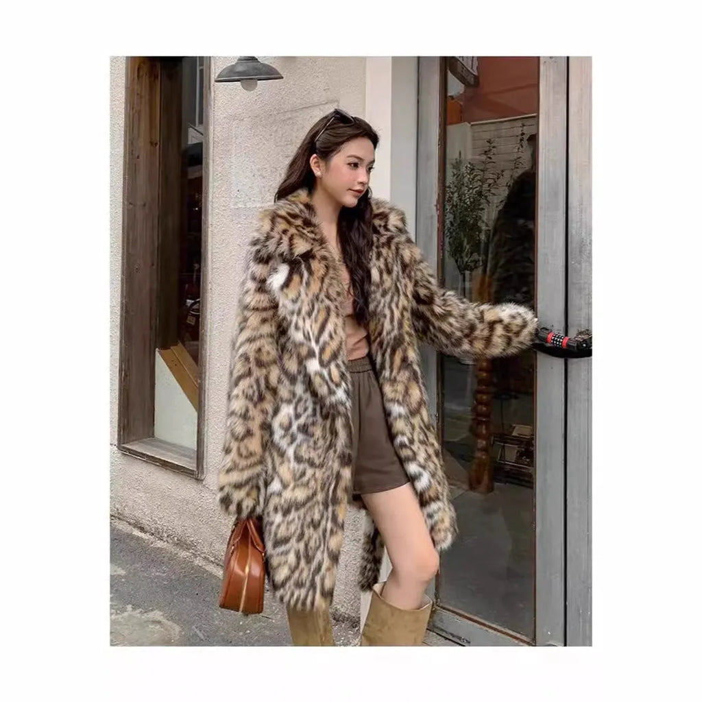 Long faux fur coat with fur collar and pockets in artificial fur fabric