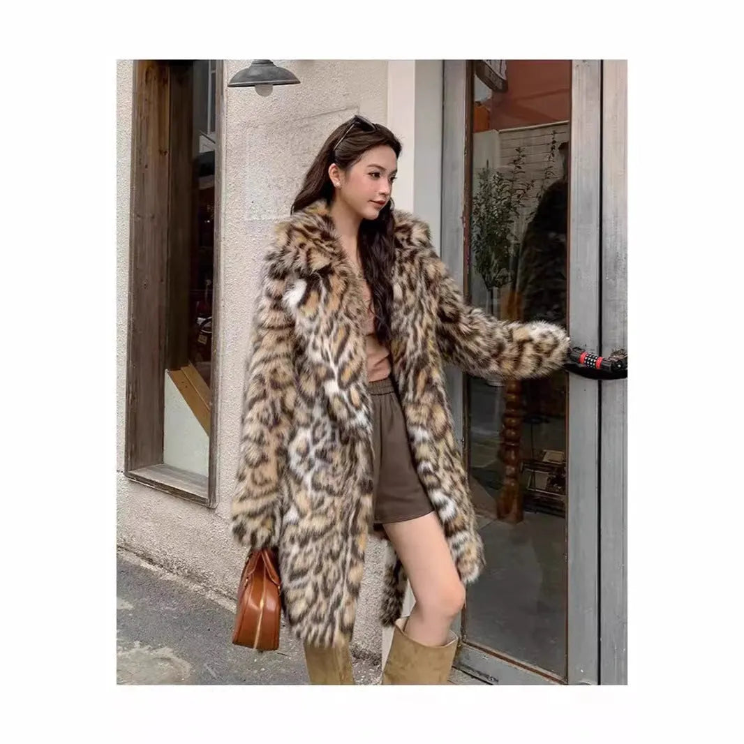 Long faux fur coat with fur collar and pockets in artificial fur fabric