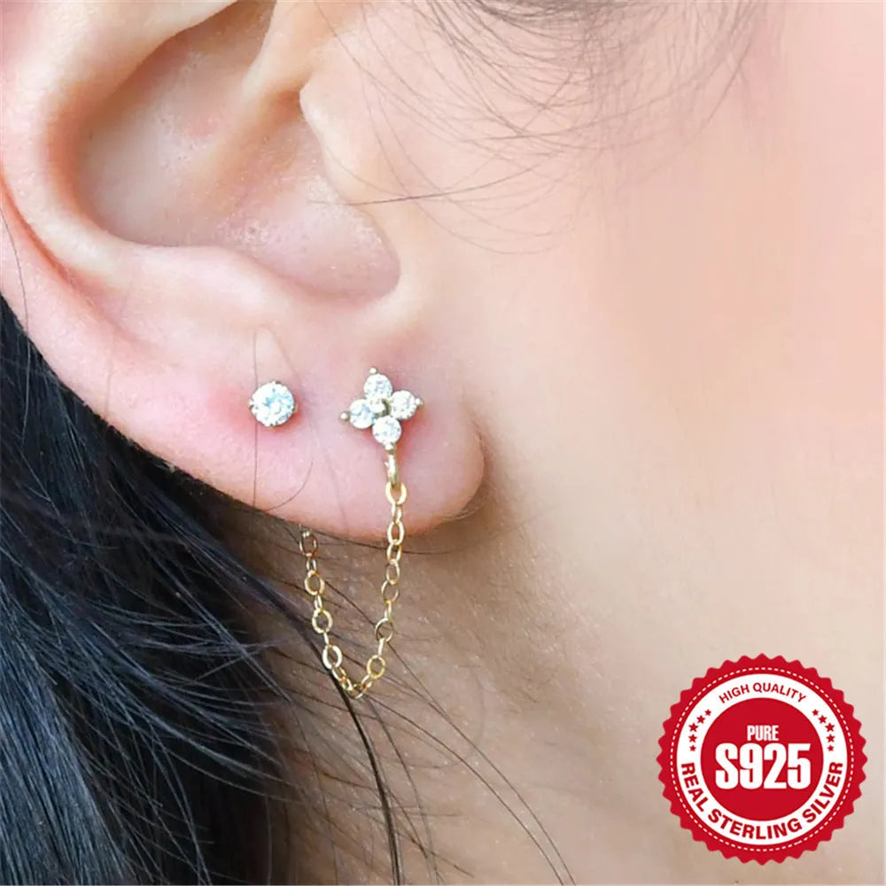 S925 sterling silver geometric ear clip studs with flower and chain design in golden electroplate.