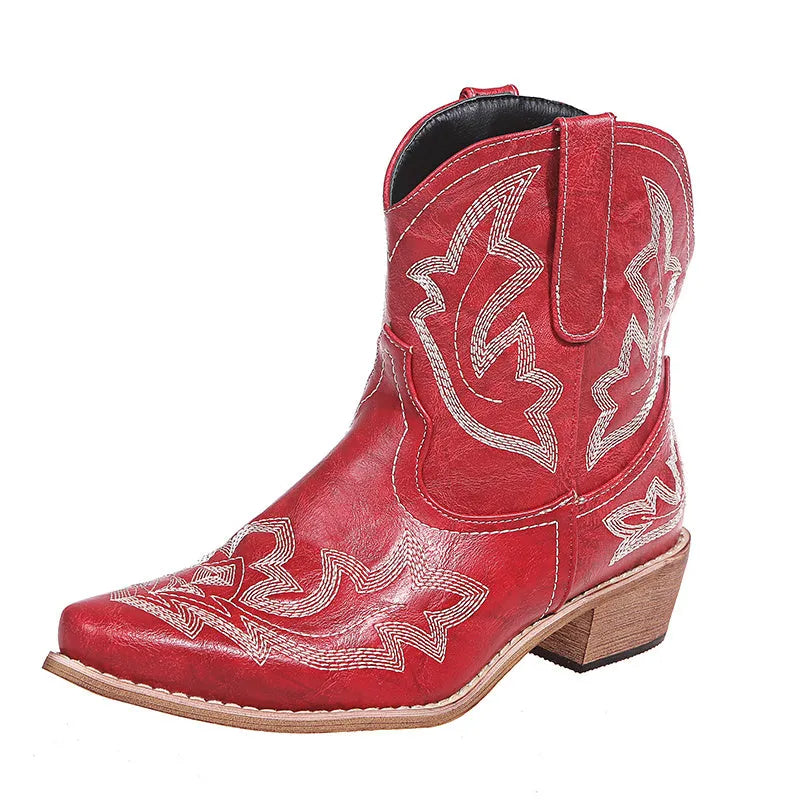 Blue women's Western cowgirl boots with embroidery detail, low wedge heel, and pointed toe.