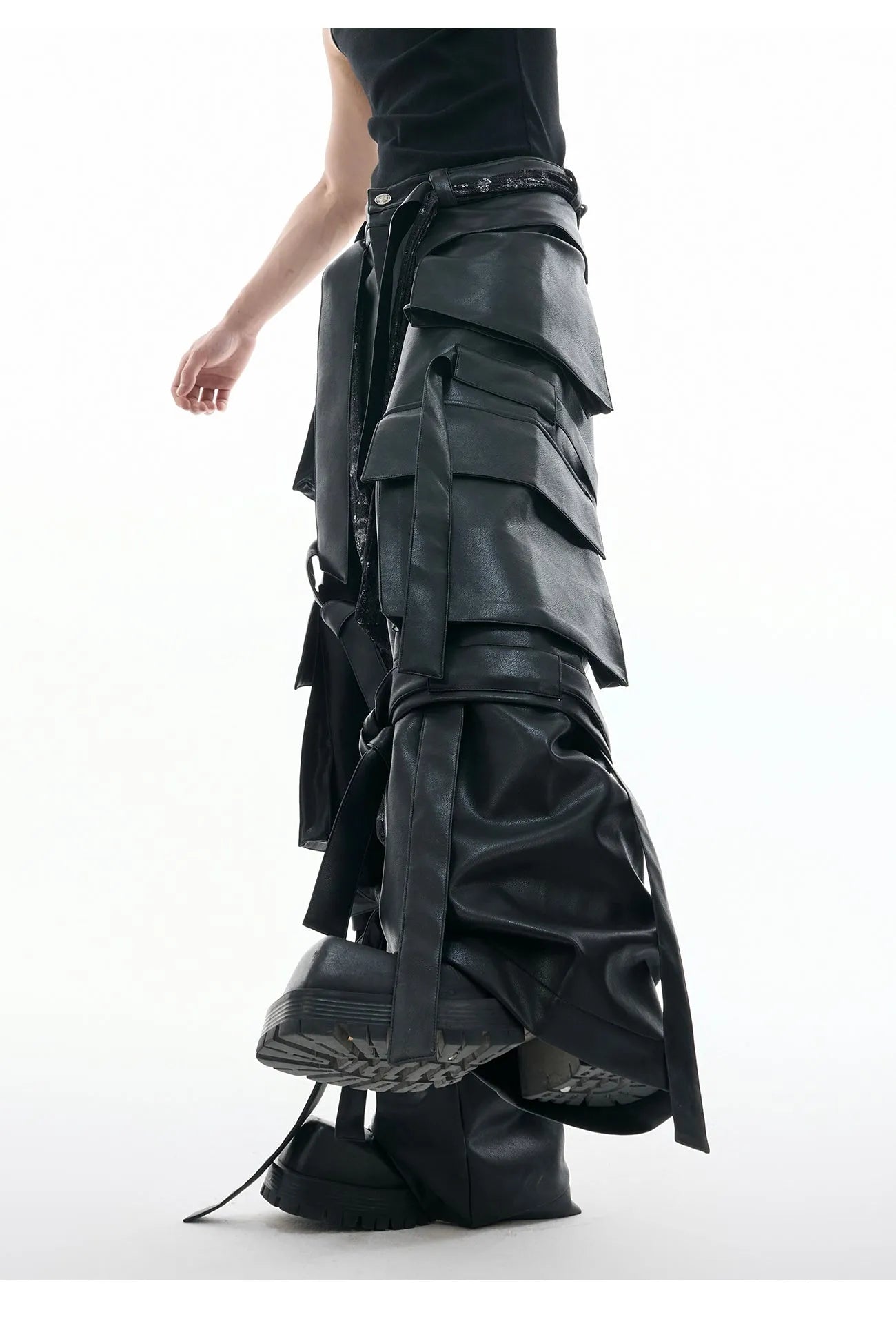 Black quilted leather pants with multiple pockets and decorative stitching ribbon details