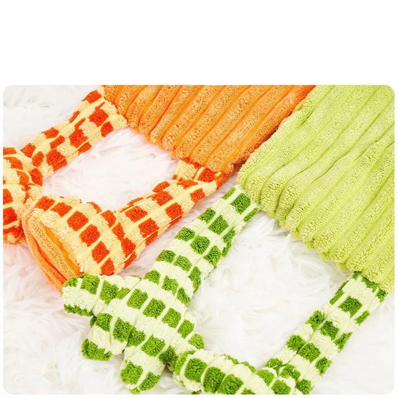 Green and orange 4-inch plush dog toy with squeaker for aggressive chewers