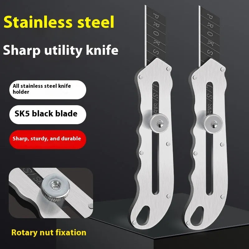 Stainless steel folding art knife with a black blade, shown with a set of long and trapezoidal spare blades.