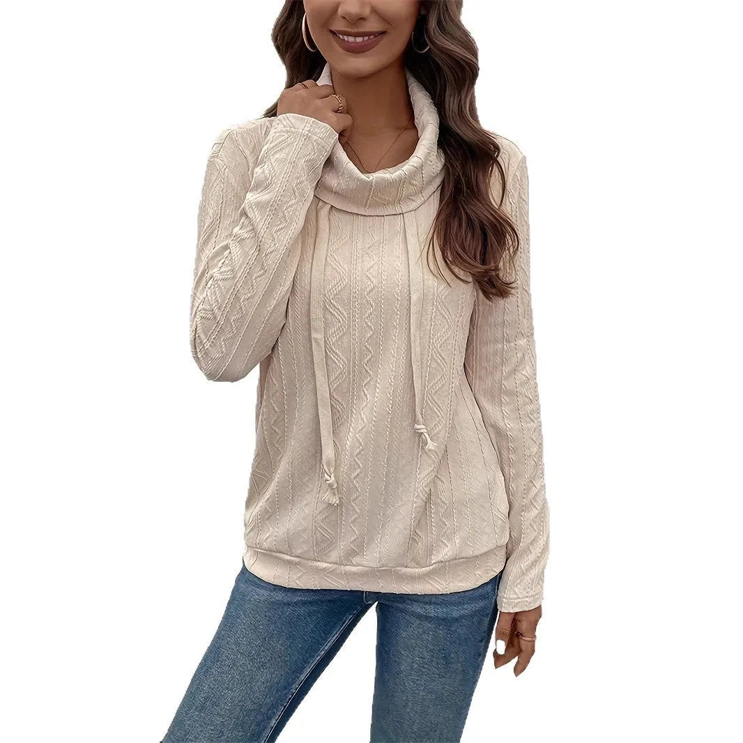 Apricot coloured long sleeve hooded pullover sweater on a hanger, showing the drawstring and solid colour.