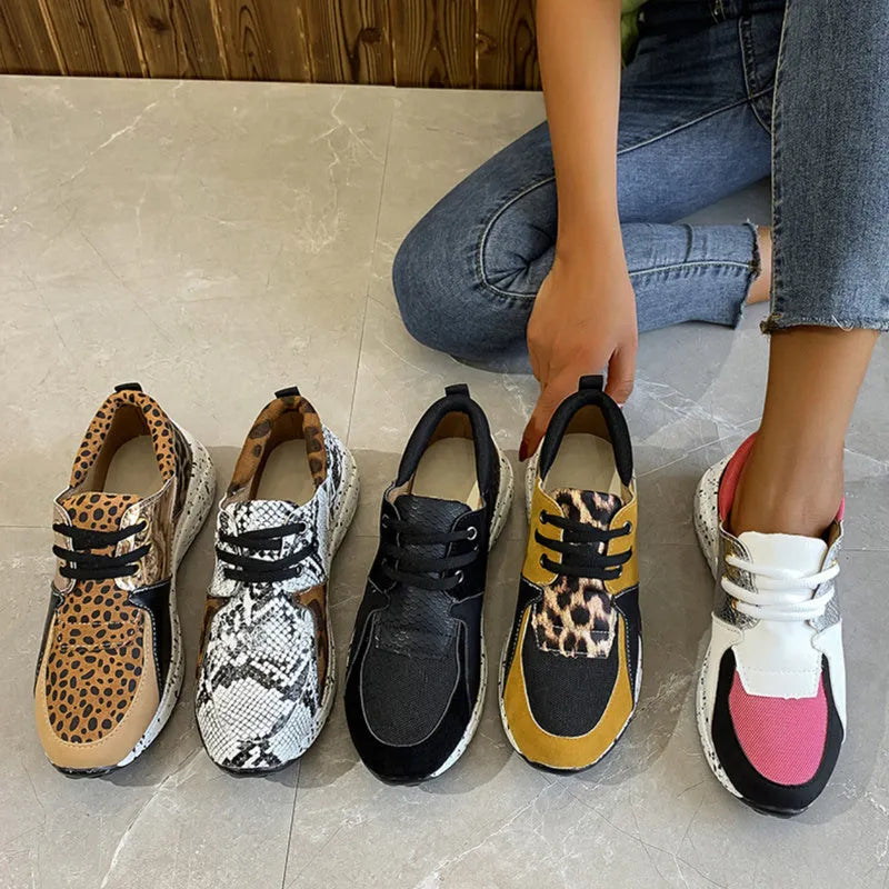 Women's suede casual flat sneakers with a wedge heel in leopard print.