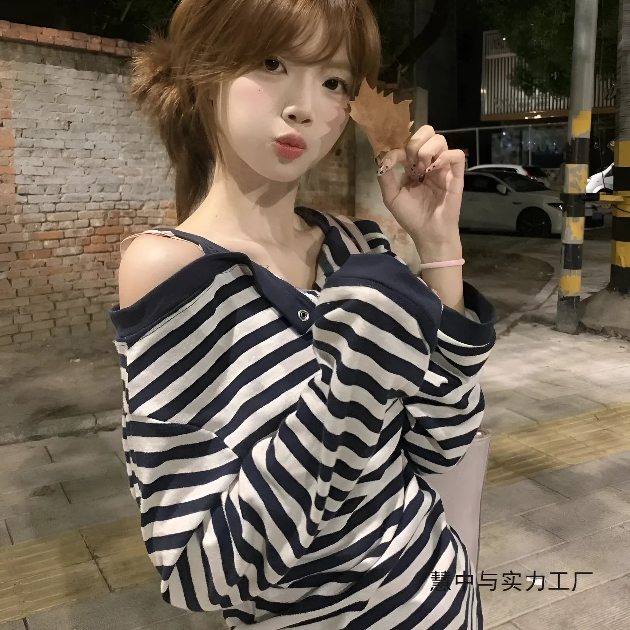 Dark blue women's oversized long-sleeve t-shirt with Korean style, embroidery, and stripe details.