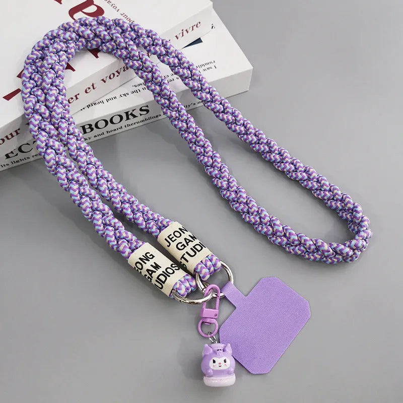 Woven nylon crossbody phone lanyard with macaron pendant in Pink Dot Gray, showing three-strand horse tail detail and matching clip.