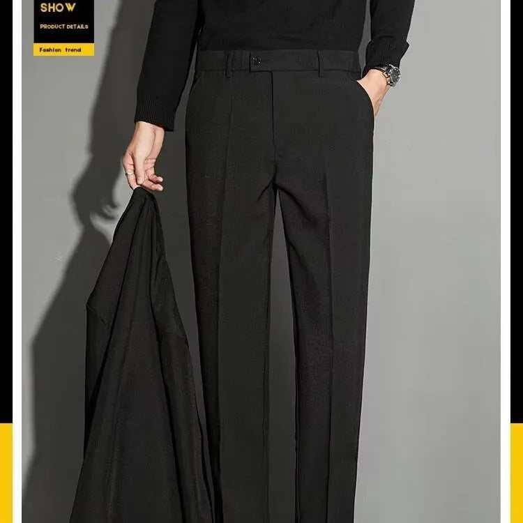 Men's straight-leg ankle-length suit trousers in a light colour showing spring draping effect detail.