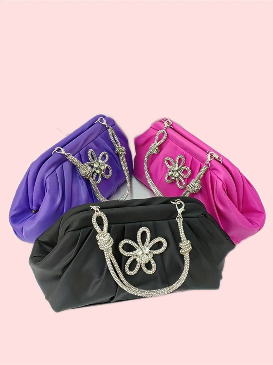 Soft black polyester women's shoulder messenger bag showing chain detail and fold styling.