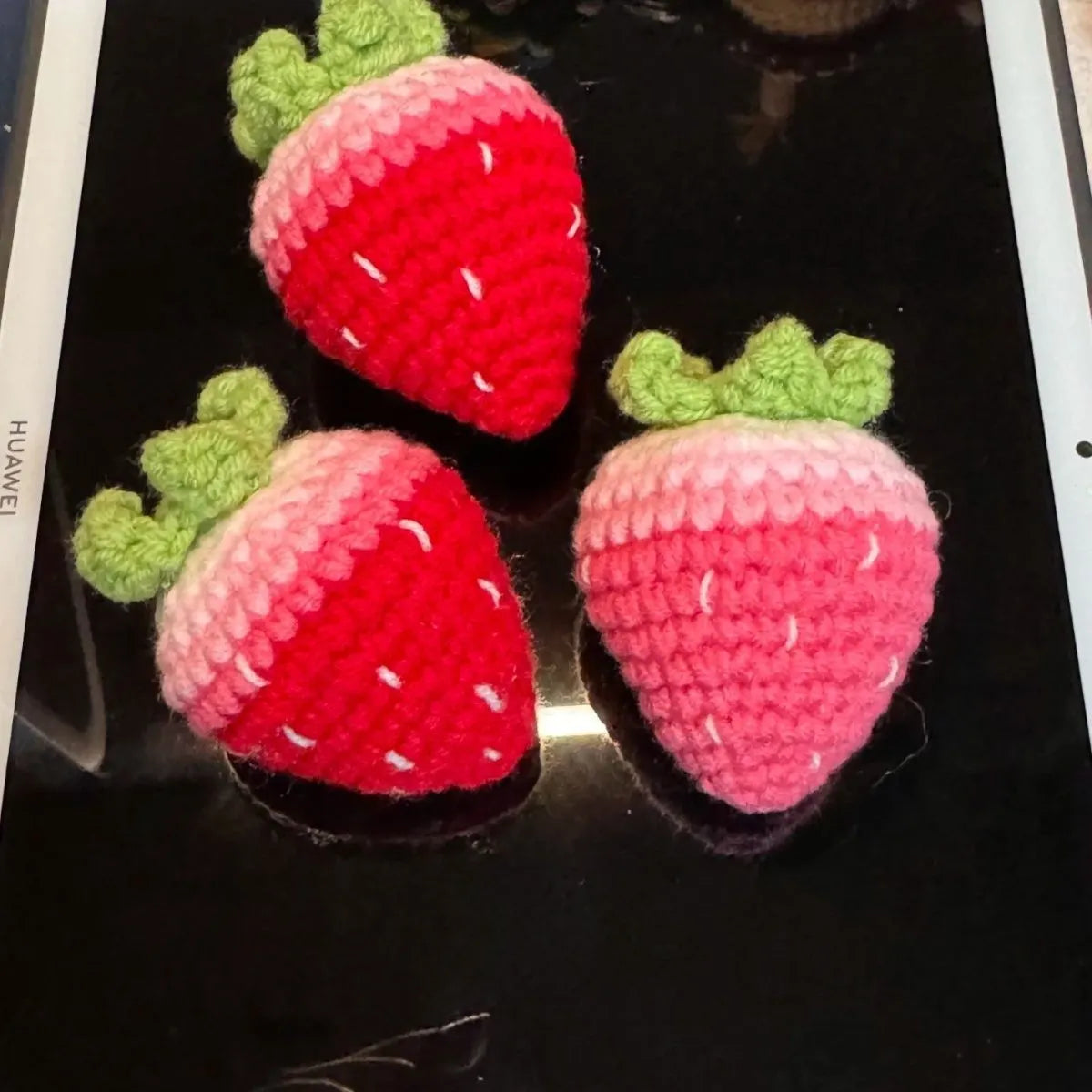 Soft plush strawberry pendant keychain in pink and red colour options with metal ring