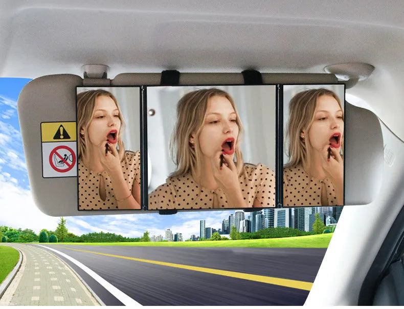 Silver portable car folding mirror shown both closed and opened on a flat surface.