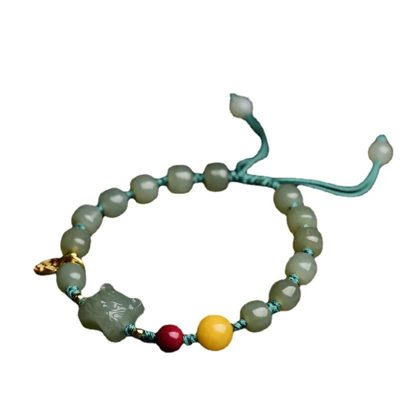 Natural Hetian jade bracelet with red cinnabar and amber beeswax beads, animal zodiac design