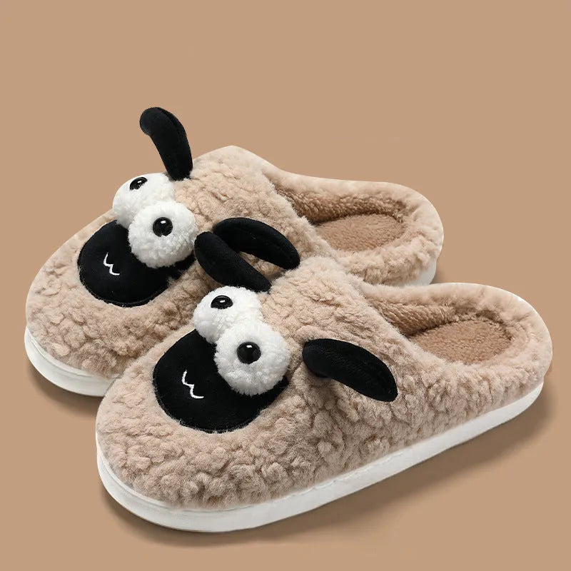 Brown slip-on slippers with suede upper and lamb thermal cotton lining on wooden floor