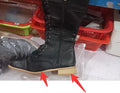 Women's black knight ankle boots with a cross strap detail on the front.