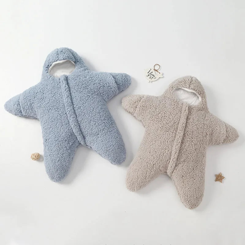 Cashmere and cotton baby sleeping bag with hood, shown in pink, grey, light blue, or khaki.