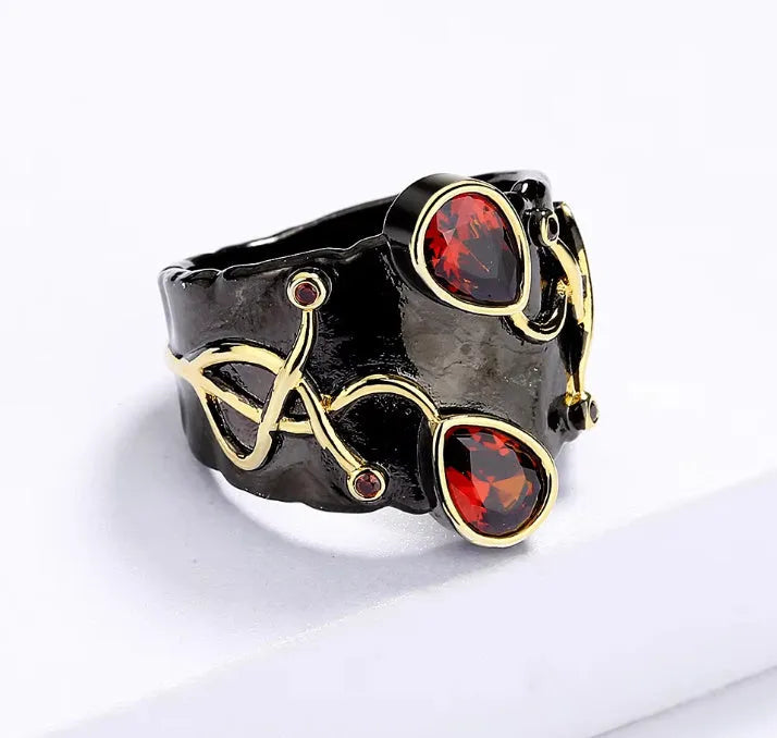 Retro women's brass oval ring in black finish on white background