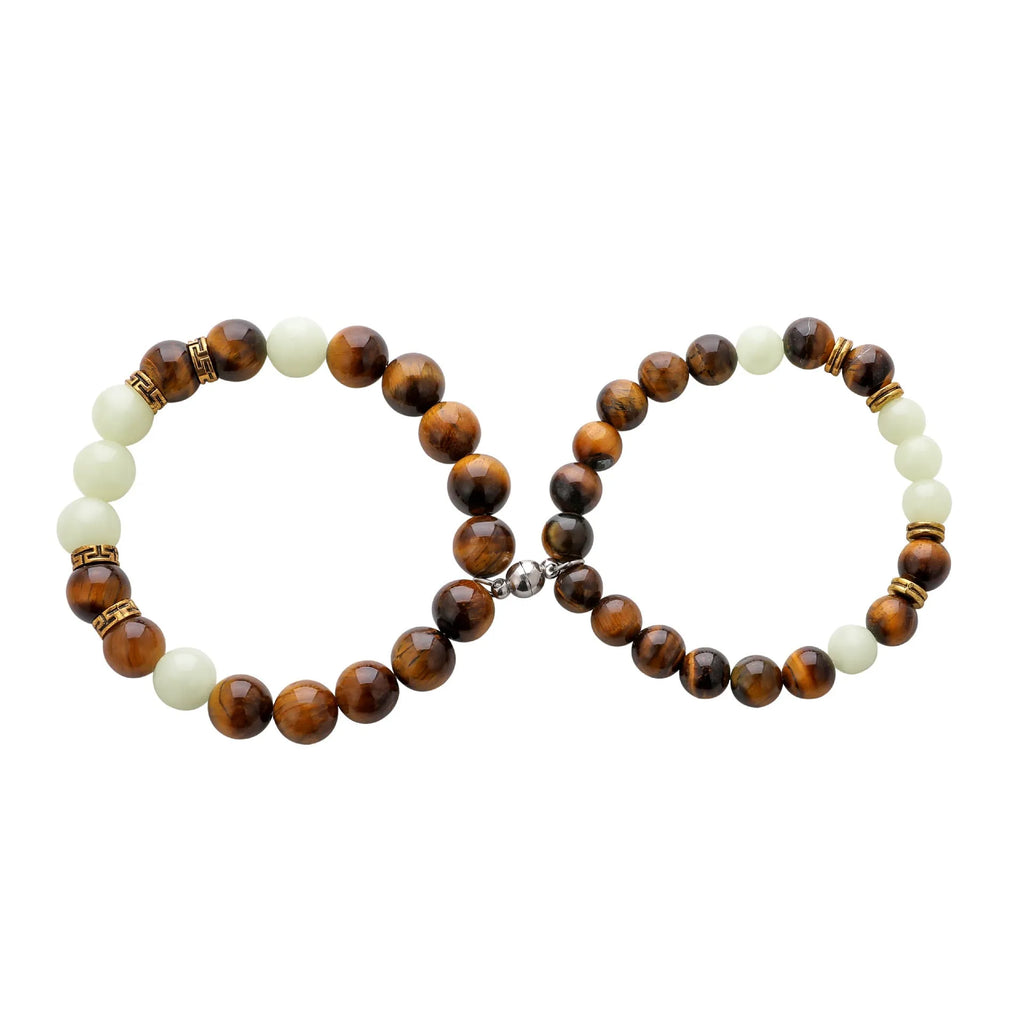 Geometric amber couple bracelets with luminous retro styling on display