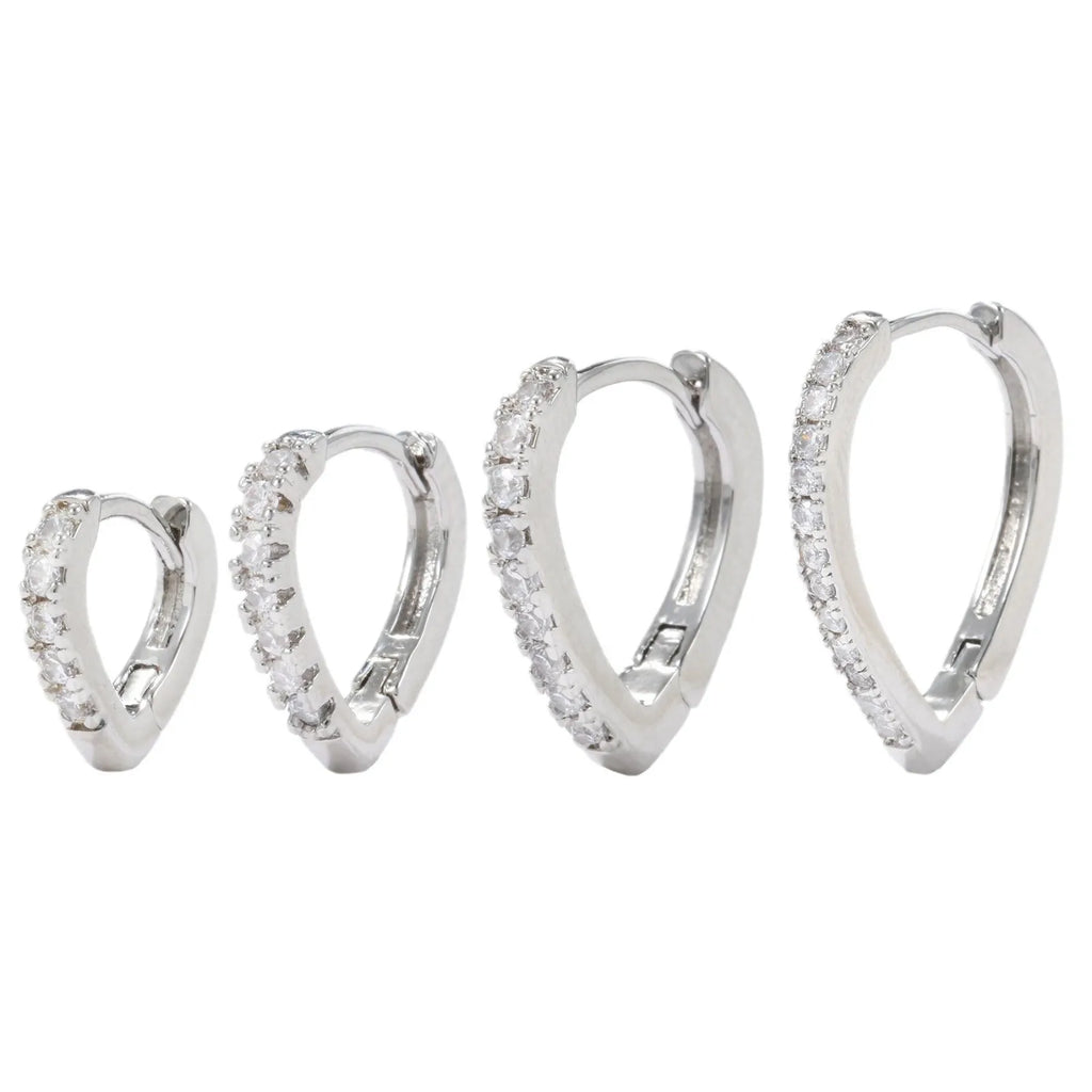 Geometric heart-shaped copper ear clip with electroplated gold finish for women.
