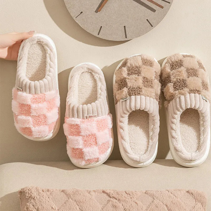 Women's plaid plush slippers in coffee colour with a soft upper, plush lining, and textured PVC sole.