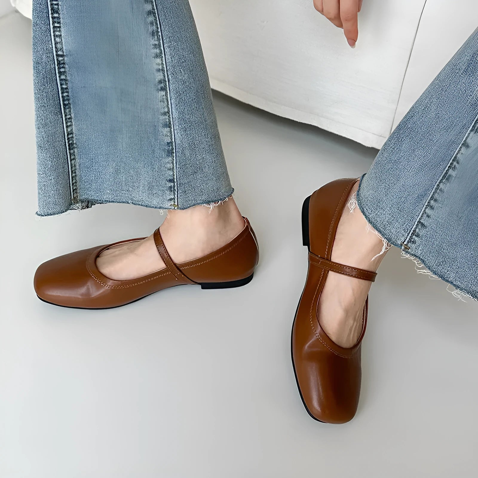 Retro style Mary Jane flat shoes in sheepskin with pigskin lining, shown in a solid colour with round toe and low heel.