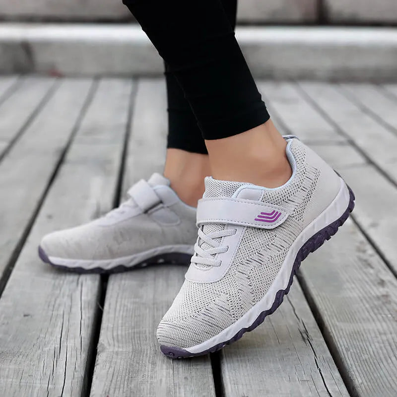 Women's low-top grey purple wedge heel casual shoes with velcro strap on soft mesh upper.
