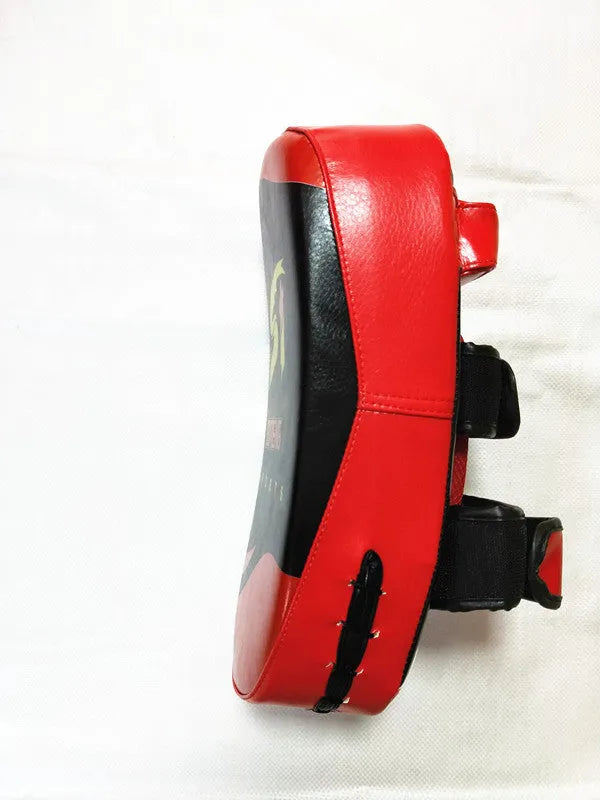 Black and red square hand-held martial arts training target with a double buckle.
