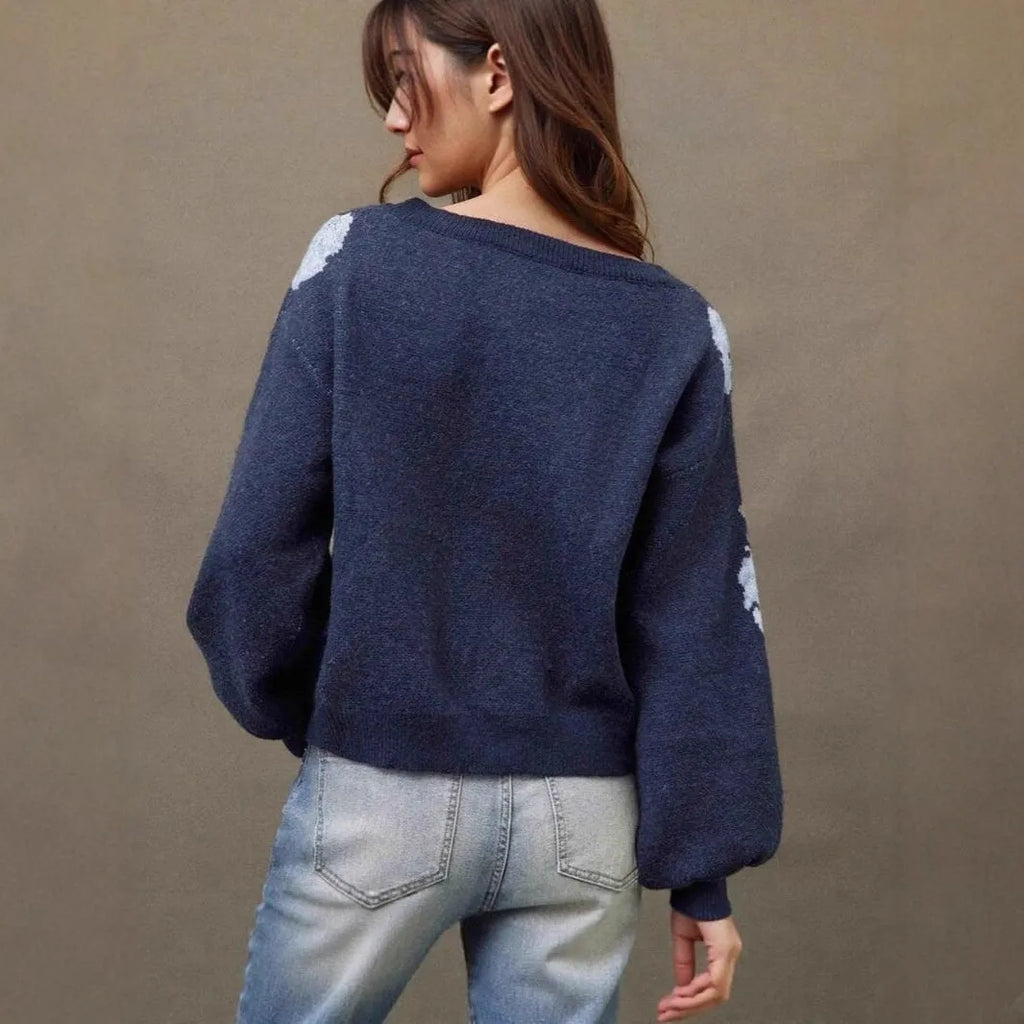 Sapphire blue women's loose pullover with floral jacquard pattern and off-neck design.