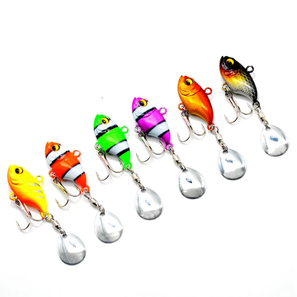 Metal fishing lure with a rotating sequin in a selection of colours on a blue background.