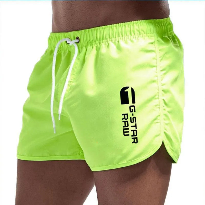 Men's thin hemp-blended polyester sport shorts in multiple colours on a mannequin, showing elastic waistband.