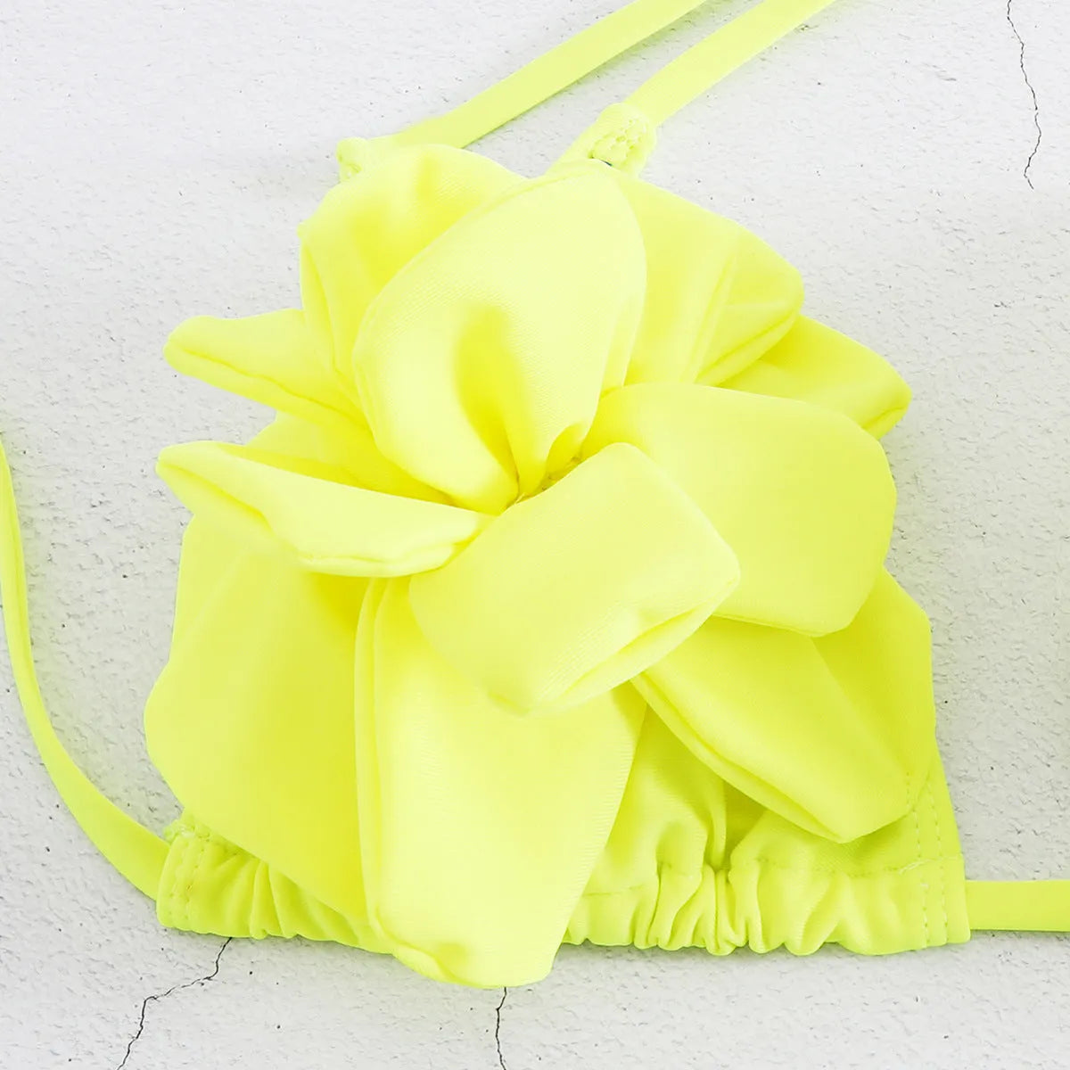 Low waist bikini swimsuit with 3D flower pattern in solid colour BA24448G1.