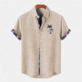 Loose fit light blue linen short sleeve shirt with a detailed ocean fish pattern embroidered on the lapel.