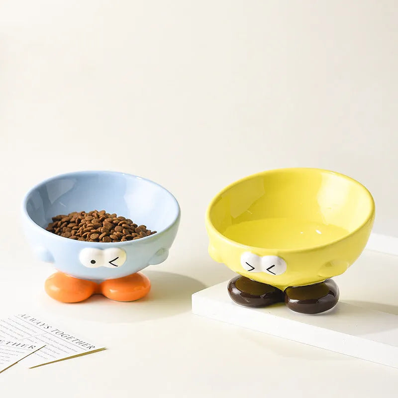 Blue slanted ceramic pet bowl with cute expression design for cat and dog cervical spine support